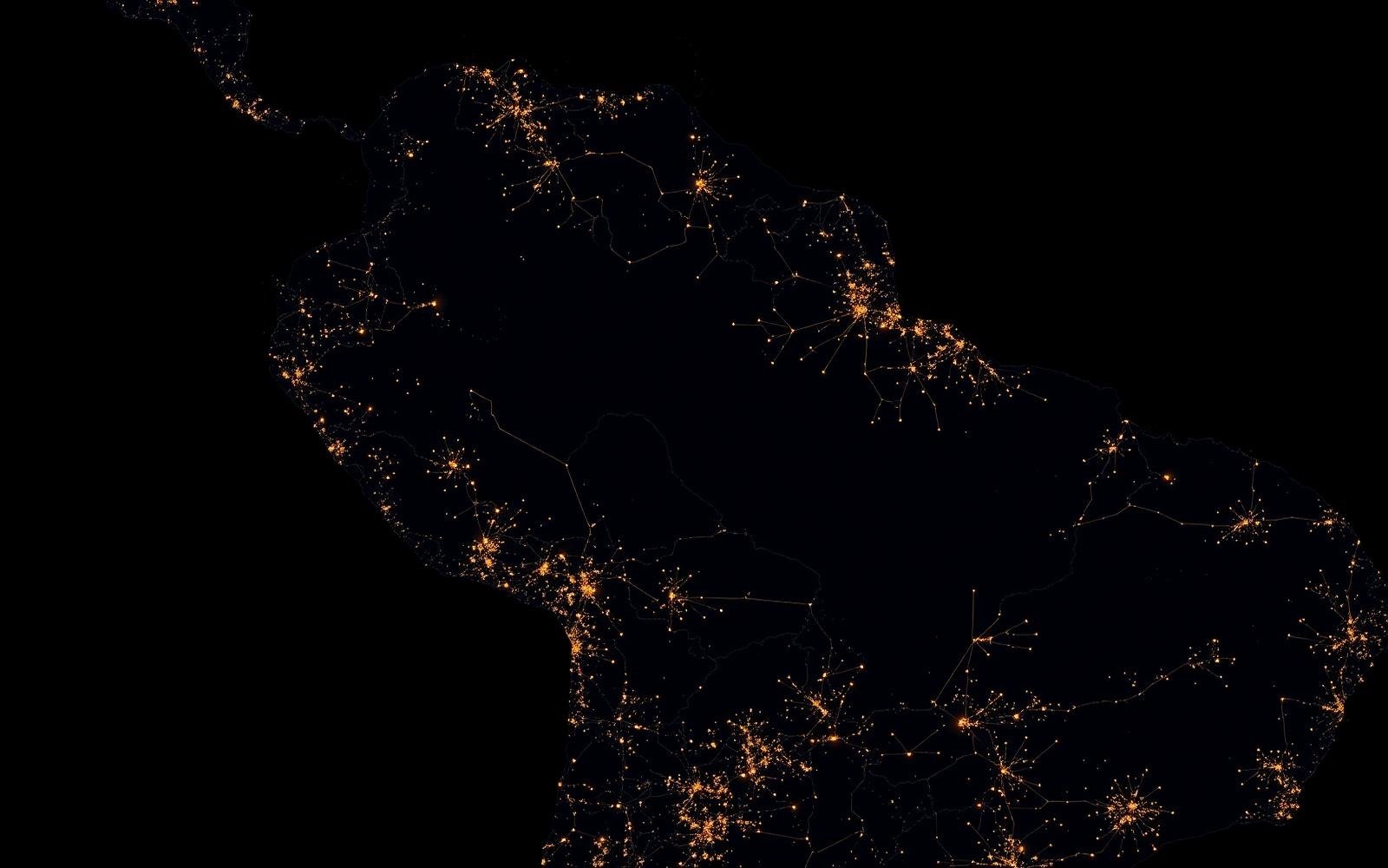 Night-time satellite view of South America showing settlement and infrastructure corridors